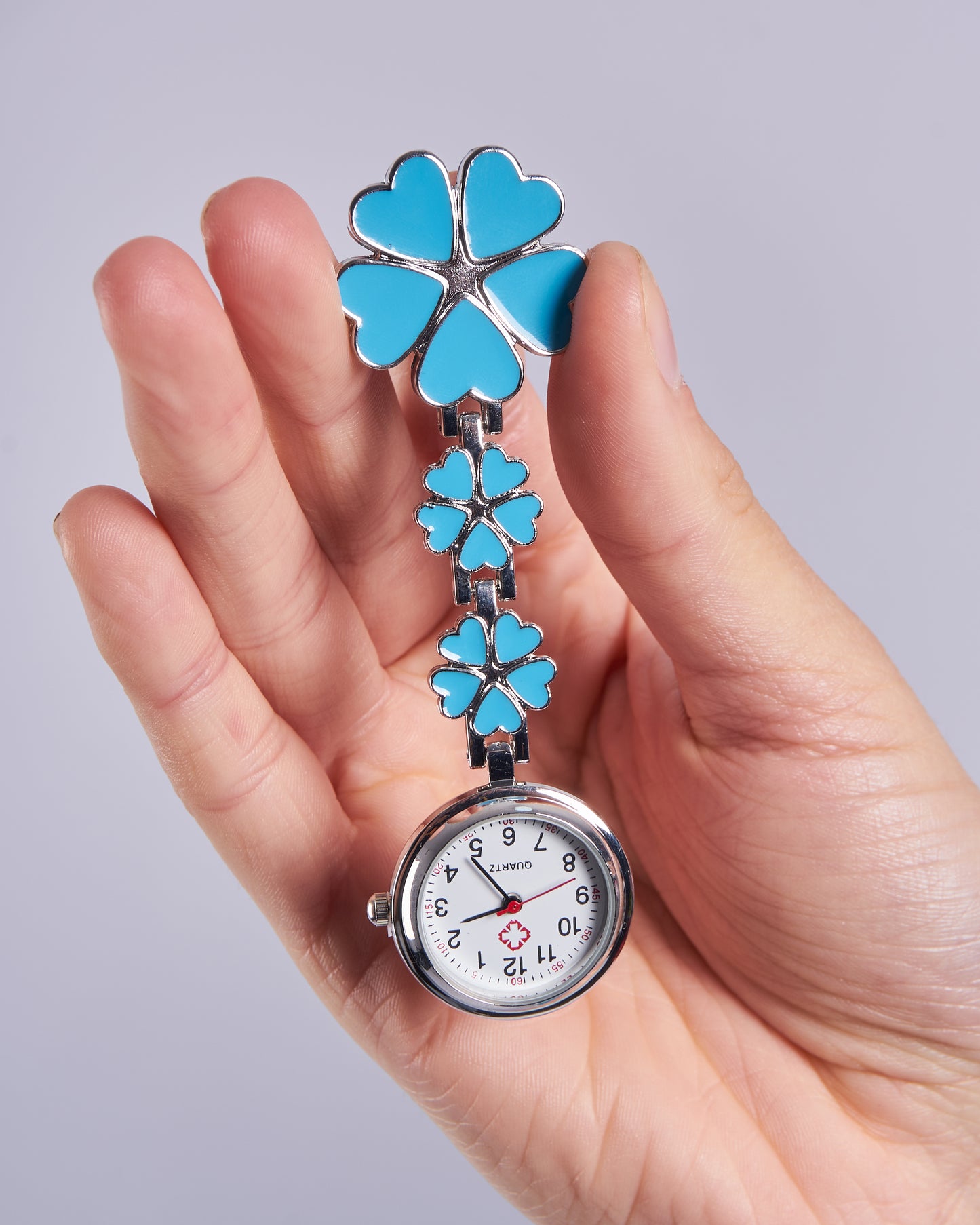 Reloj prendedor flores