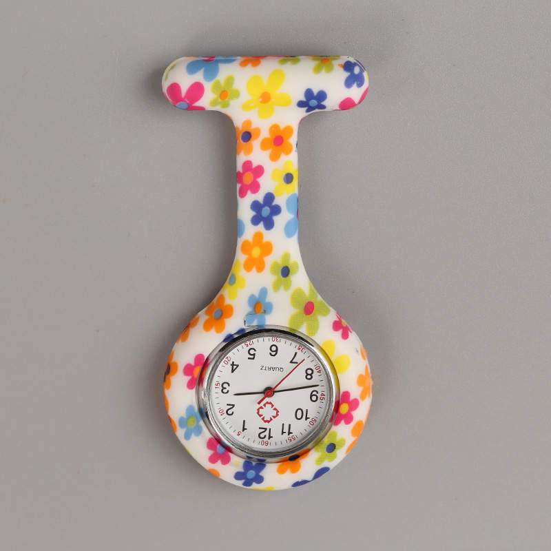 Reloj prendedor flores de colores