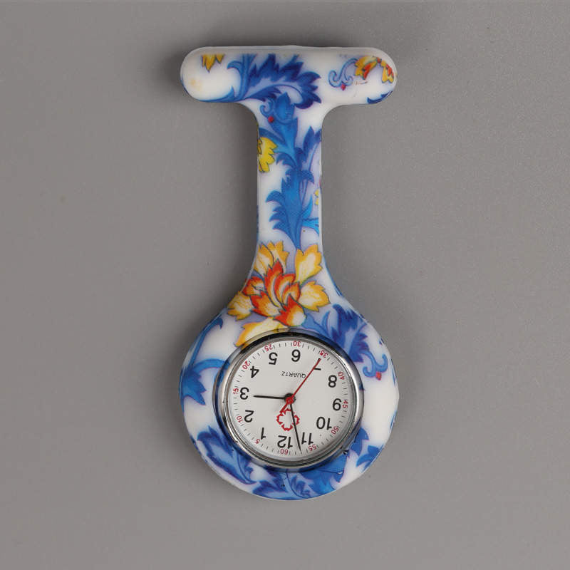 Reloj prendedor flores azul